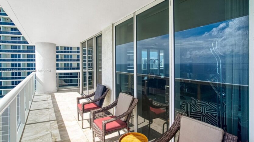 magnificent condo with breathtaking ocean view outside chairs